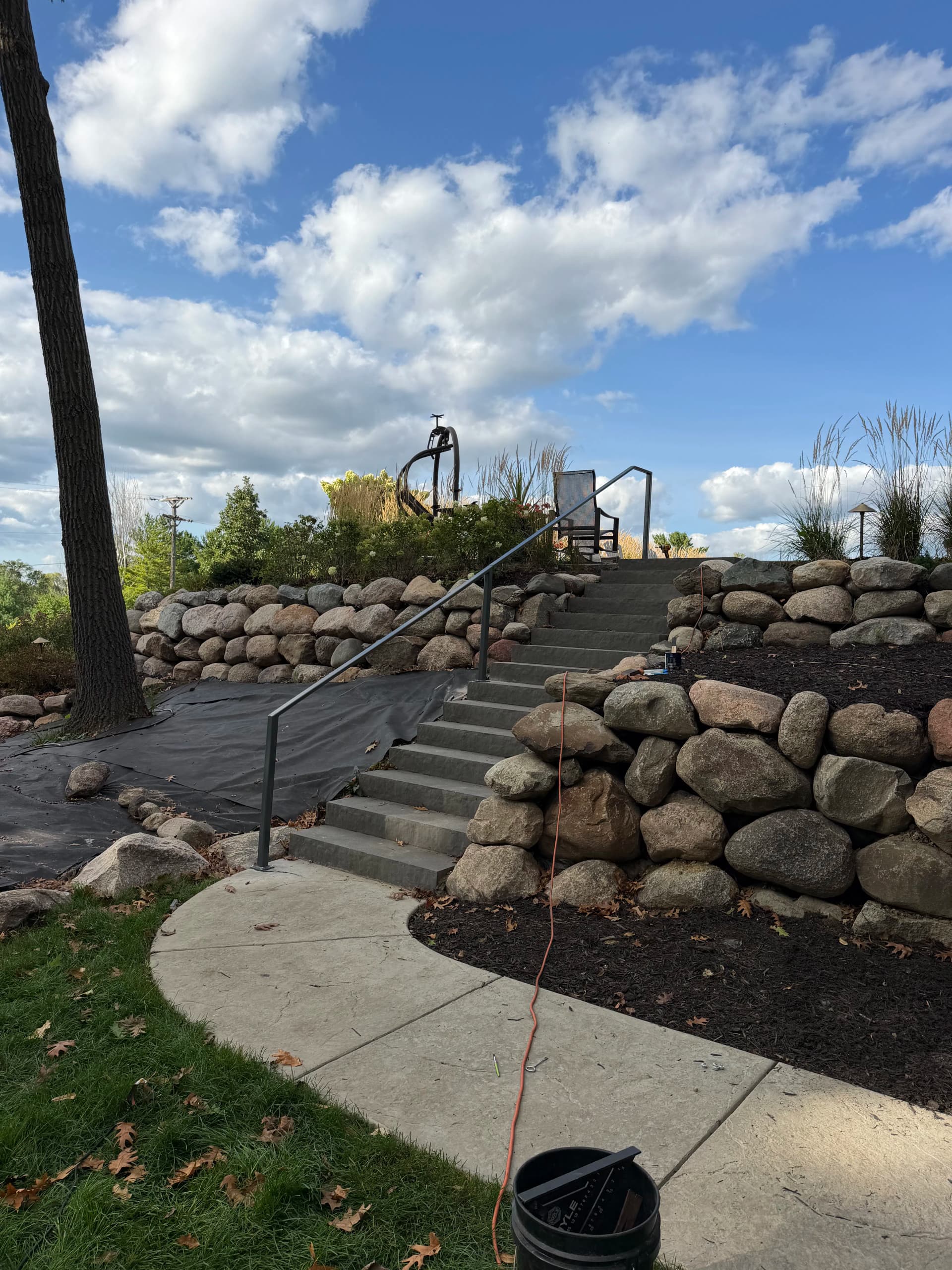 Custom Handrail Installation on a Striking Stone Staircase in Orono