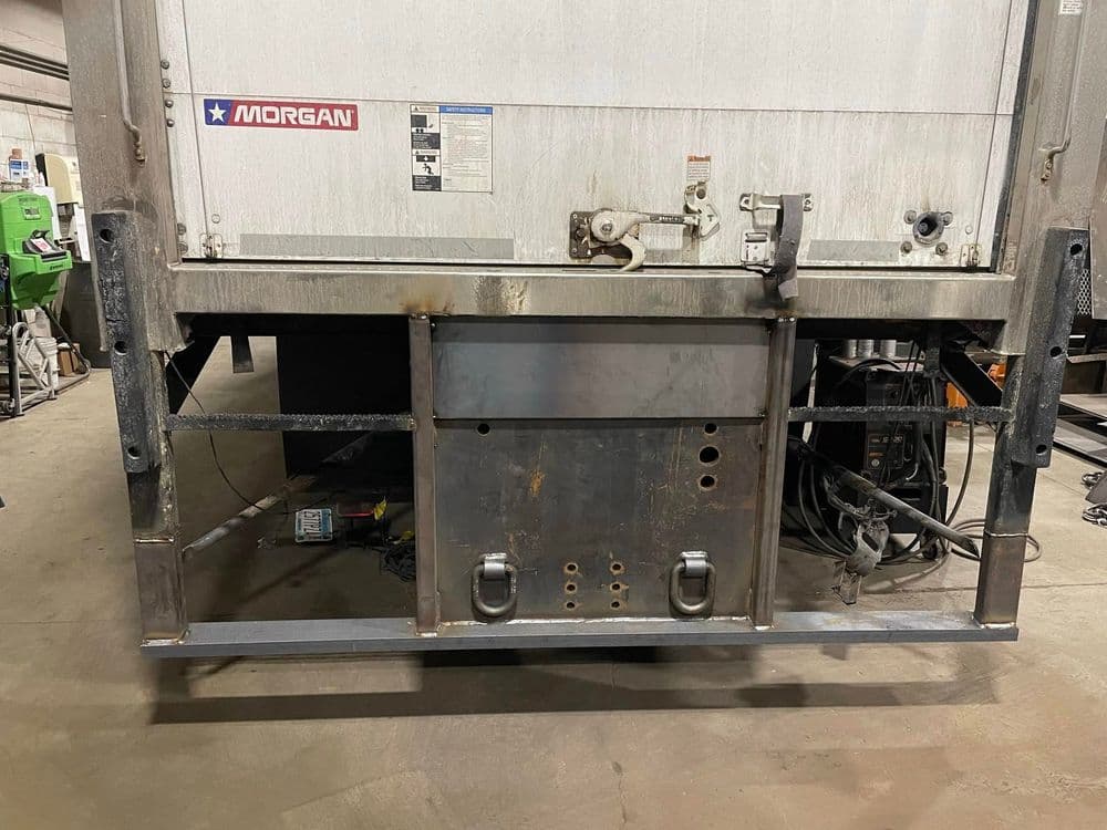 Morgan truck trailer rear view showcasing metal support structure and welding details.